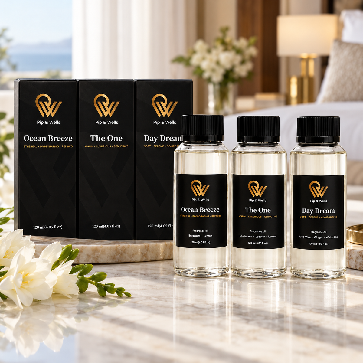 Zestaw prezentowy Pip & Wells Hotel Fragrances z butelkami Ocean Breeze, The One i Day Dream obok ich czarnych pudełek